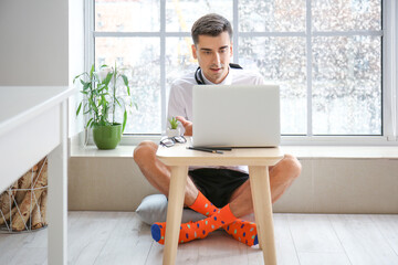 Young businessman working at home