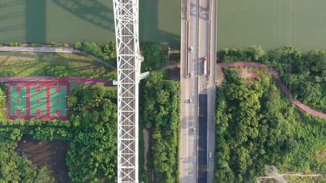 Drones follow to take pictures of high-speed trains and cars on railway bridges and highway bridges in China