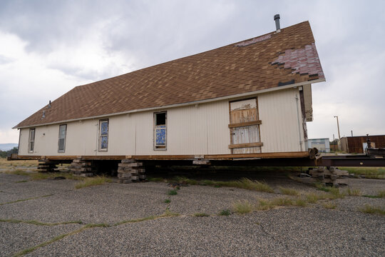 House lifted from its foundation on pallets, to be physically transported and moved to a new location