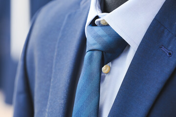 Mannequin with male clothes in boutique, closeup