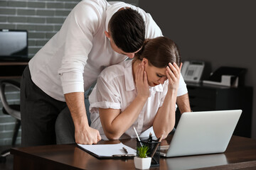 Boss harassing his secretary in office