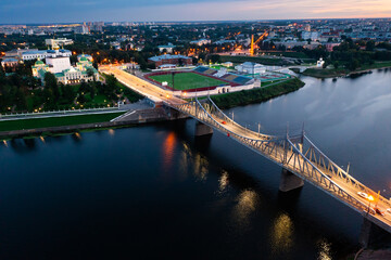 Scenic aerial view of Tver cityscape on banks of Volga river overlooking Transfiguration Cathedral on summer twilight, Russia