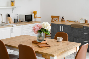 Interior of stylish kitchen with dining table