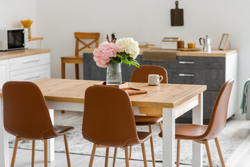 Interior of stylish kitchen with dining table