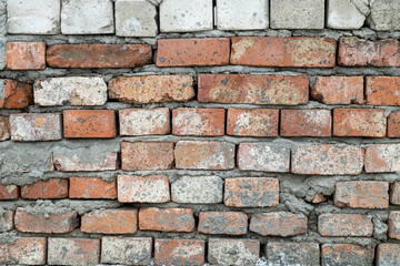 Red brick wall, real wall of an old brick house, close-up