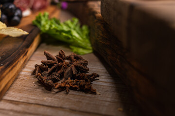 star anise meat table sausage almonds and grapes cheese