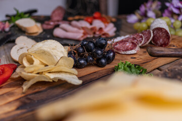 star anise meat table sausage almonds and grapes cheese