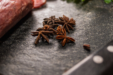 star anise meat table sausage almonds and grapes cheese