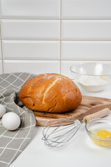 Cooking bread in the kitchen. Eggs, flour, bread close-up