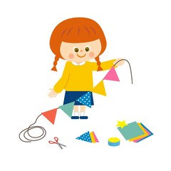 パーティーの飾り付けをする女の子