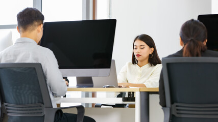 Beautiful asian woman is working in modern office.