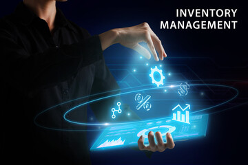 Business, Technology, Internet and network concept. Young businessman working on a virtual screen of the future and sees the inscription: Inventory management
