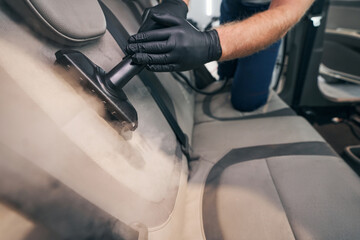 Professional steaming with high pressure vapor tool. Detailing service