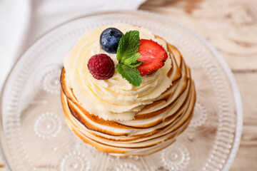 Dessert stand with tasty Pavlova cake on table, closeup