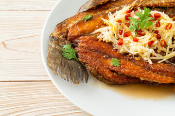 Fried Sea Bass Fish with Fish Sauce and Spicy Salad