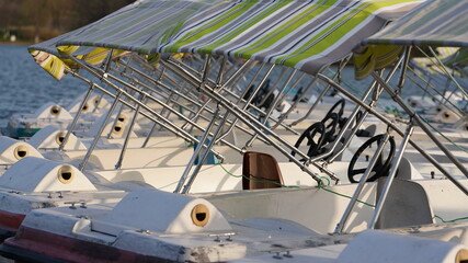 The little playful boats docked in the dock in the park