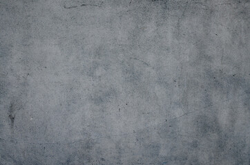 Cracked old cement wall background. Close up of antique concrete texture backdrop.