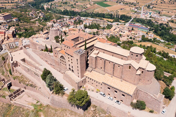 Fototapeta na wymiar Scenic summer view from drone of medieval fortress with romanesque Church of Sant Vicenc on hilltop in Spanish town of Cardona, Catalonia