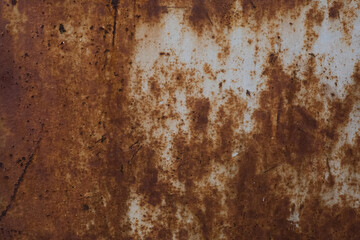 old rusty iron sheet covered with brown rust and grey paint. Background and wallpaper picture. Corrosion. Ecological pollution concept. Reconstruction and reparation needed. Ugly metal surface