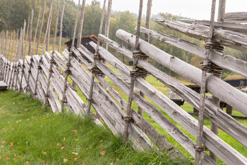 Traditional hand made roundpole fence in Uvdal, Norway