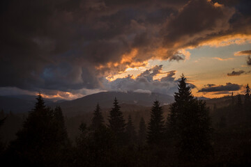 Scenic view of majestic mountains with cloudy sky