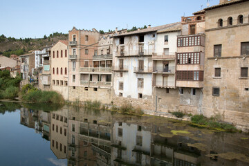 Fototapeta premium Buildings on River Bank in Valderrobres