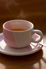 cup of hot green tea on the table
