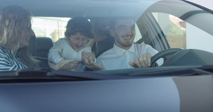 Young Family With Children In Car. Happy Family In Car.