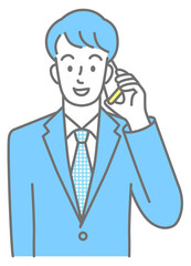 Upper body of a young man in a suit talking on a cell phone (colored)