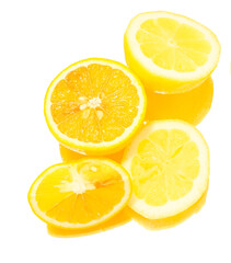 slices of orange and lemon on white background.