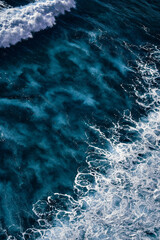 Aerial view to seething waves with foam. Waves of the sea meet each other during high tide and low tide - 459840602