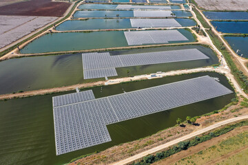 Floating Solar panels in a large water reservoir, Aerial view.