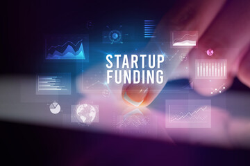 Finger touching tablet with business graphs and icons concept