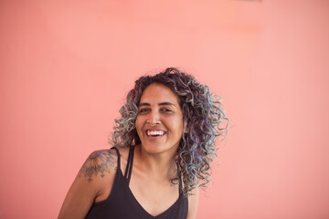 Portrait of smiling woman with curly hair