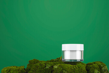 Cosmetic cream pot on green moss. Skincare products ,natural cosmetic. Beauty concept for face and...