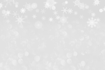 snowflakes on a light gray background with bokeh. Christmas and New Year pattern. Backdrop drop for postcards