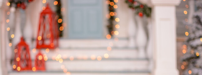 Beautiful blurred Christmas background in the form of Christmas porch out of focus for background...