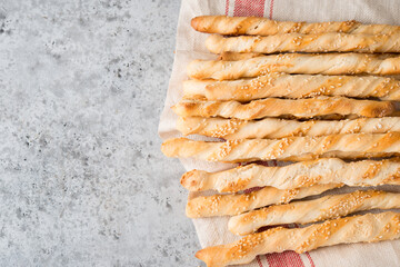 Italian grissini breadsticks with herbs and sesame seeds, top view