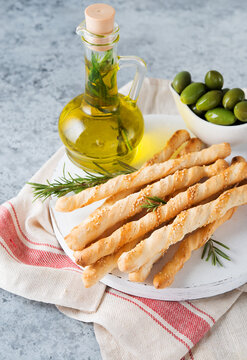 Grissini breadsticks with sesame seeds - traditional Italian snack, selective focus