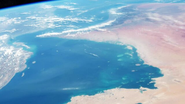 Qatar flag and football soccer sport symbol fade in on planet earth view from space. Based on image furnished by nasa