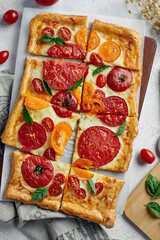 Delicious homemade square pizza with vegetables on white