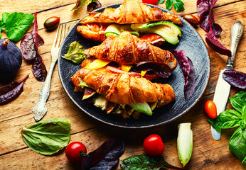 Fresh croissants with meat and fish