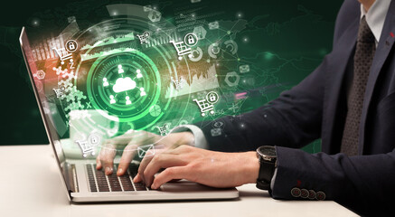 Business hand typing on a modern laptop