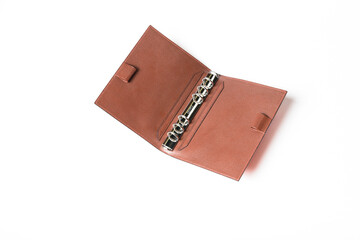 A personal organizer made of leather.