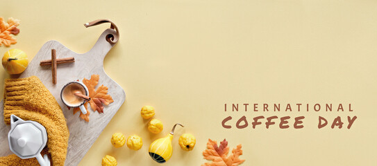 Fototapeta na wymiar International coffee day, October 1. Seasonal Autumn flat lay with espresso, cinnamon sticks, dry leaves, decorative pumpkins and quince. Panoramic banner composition in yellow and orange on paper.