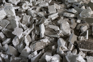 pile dirty  styrofoam waste from construction.