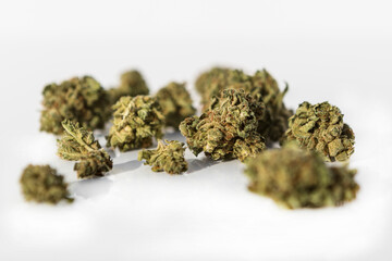 Marijuana pieces on isolated white background