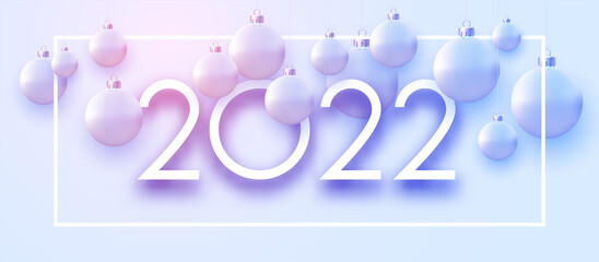2022 sign with hanging beautiful Christmas baubles..