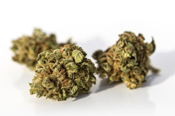 Marijuana pieces on isolated white background