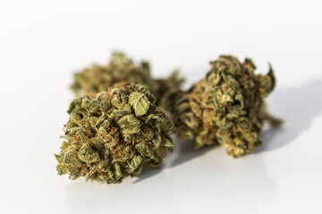 Marijuana pieces on isolated white background